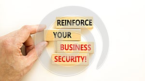 Reinforce your business security symbol. Concept word Reinforce your business security on blocks. Beautiful white table white