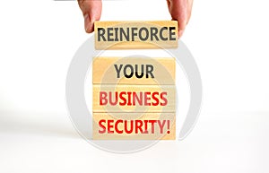 Reinforce your business security symbol. Concept word Reinforce your business security on blocks. Beautiful white table white