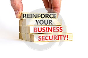 Reinforce your business security symbol. Concept word Reinforce your business security on blocks. Beautiful white table white