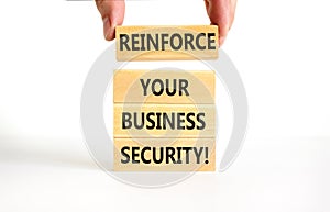 Reinforce your business security symbol. Concept word Reinforce your business security on blocks. Beautiful white table white