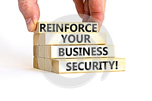 Reinforce your business security symbol. Concept word Reinforce your business security on blocks. Beautiful white table white