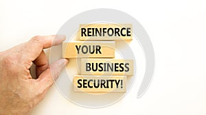 Reinforce your business security symbol. Concept word Reinforce your business security on blocks. Beautiful white table white