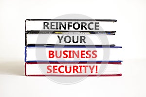 Reinforce your business security symbol. Concept word Reinforce your business security on books. Beautiful white table white