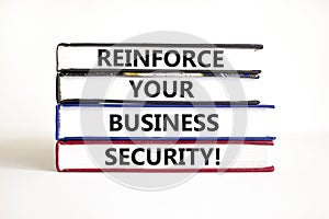 Reinforce your business security symbol. Concept word Reinforce your business security on books. Beautiful white table white