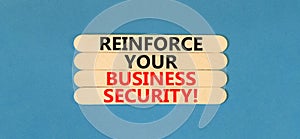 Reinforce your business security symbol. Concept word Reinforce your business security on sticks. Beautiful blue table blue