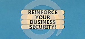 Reinforce your business security symbol. Concept word Reinforce your business security on sticks. Beautiful blue table blue