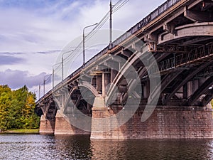 Reinforced concrete bridge across the river. Cityscape