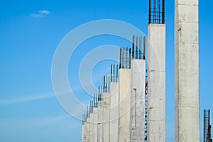 Reinforced concrete column structure in construction site with blue sky