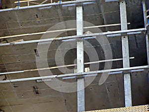 Reinforced concrete columns and monolithic floor slabs. Residential multi-storey building under construction