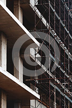 Reinforced concrete form structural building construction site with scaffolding