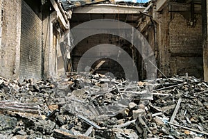 Reinforced concrete roof structures and roof metal sheet of an industrial building collapsed after a fire