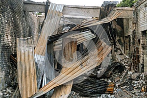 Reinforced concrete roof structures and roof metal sheet of an industrial building collapsed after a fire