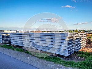 Reinforced concrete slabs stacked next to a newly built residential house