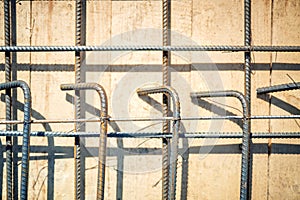 Reinforced concrete with steel bars on wooden floor on construction site