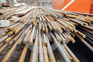 Reinforcement rods at construction site. Steel rebar close up. Rusty steel reinforcement bars for concrete. Process of house