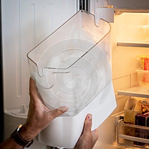 Reinstalling a ice maker in a freezer photo