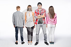 Reir view of a casual group of people with a man facing the camera isolated on white photo