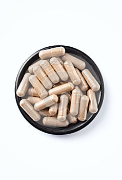 Reishi Mushroom capsules. Concept for a healthy dietary supplementation.