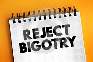 Reject Bigotry text on notepad, concept background