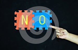 rejection and opposition word no on contrasting puzzle pieces