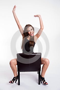 Rejoicing Young Beautiful Barefoot Woman Straddles Black Leather