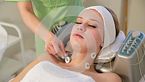 Rejuvenating facial treatment. Model getting lifting therapy massage in a beauty SPA salon. Exfoliation, Rejuvenation