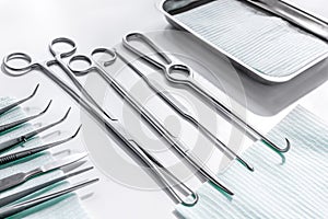 Rejuvenation by plastic surgery: medical instruments on white table backgrond