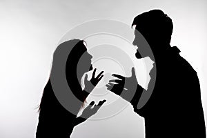 Relationship difficulties, conflict and abuse concept - man and woman face to face screaming shouting each other dispute