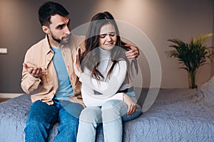 Relationship difficulties, conflict and people concept - unhappy couple having argument at home.