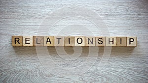 Relationship word made of cubes, family planning, man and woman relations photo