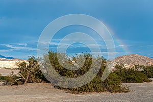 A rainbow over Furnace Creek photo