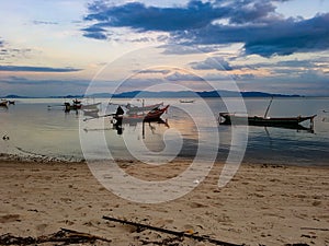 Relax beach enjoy seunset warm orange light sundown water ocean sea island sky cloud tail boat asia thailand tropical