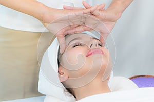 Relax beautiful women in spa salon. woman lying on the bed relaxing with massage in spa