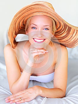 Relax, bikini and portrait of woman on sunbed at hotel for sunbathing, summer and tropical Bali vacation. Villa, resort