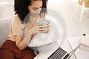 Relax, black woman and tea at laptop streaming app movie, series or tutorial on home couch. Tech, subscription and