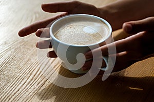 Relax in cafe or coffee shop and drinking. fresh morning coffee with milk and cream froth. barista propose americano or