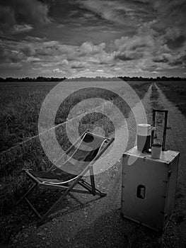 Relax corner in rice field green season. Scenic view of  agricultural landscape. Black & white photography.