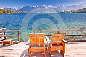 Relax deck chair by lake Luzern in Alps