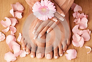 Relax, hands and feet of black woman with flower petals for luxury cosmetic treatment with manicure and pedicure nails