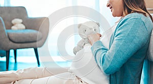 Relax, happy and pregnant woman with teddy bear in baby nursery excited for motherhood. Pregnancy belly of girl resting