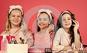 relax and having fun. small girls in beauty salon. little sisters in retro fashion headscarf. makeup for kids. group of