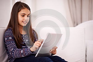 Relax, home or girl with tablet for elearning, playing games or streaming videos on a movie website. Education, online