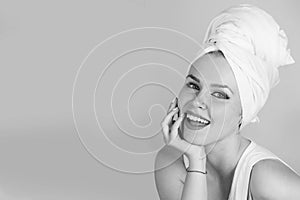 Relax and hygiene, healthcare. woman with towel turban smiling on pink background
