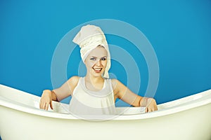 Relax and hygiene, woman with towel turban in white bathtub