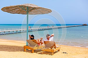 Relax of loving couple on the beach in Egypt