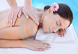 Relax, massage and woman at spa pool with flower for health, wellness and luxury holistic treatment. Self care, peace