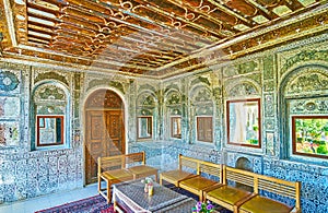 Relax in medieval mirror veranda of Persian mansion, Shiraz, Ira