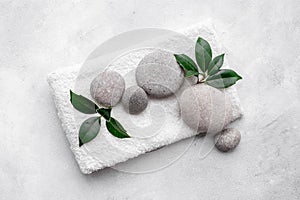 Relax and meditation with spa stones and green leaves