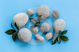 Relax and meditation with spa stones and green leaves
