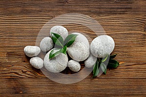 Relax and meditation with spa stones and green leaves